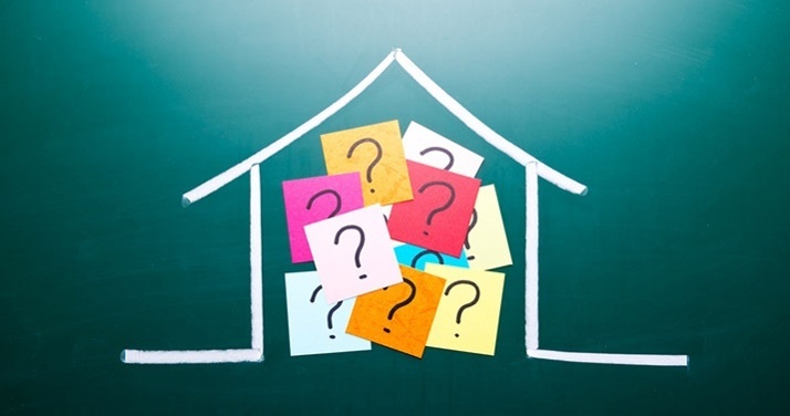 house and post it notes with question marks